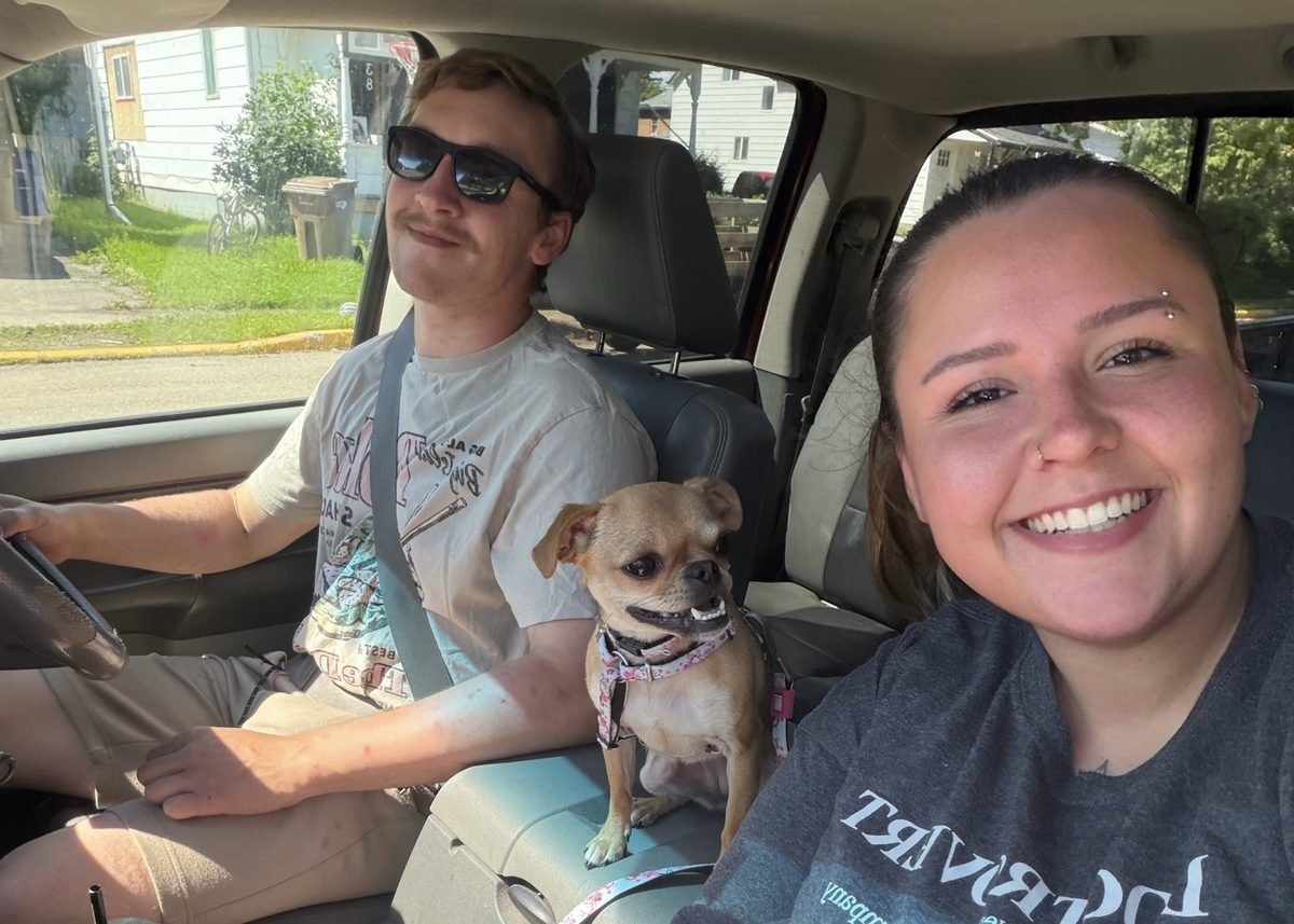 Jayde and Jordan, the owners of Bark Inn Boutique Boarding, with a small dog